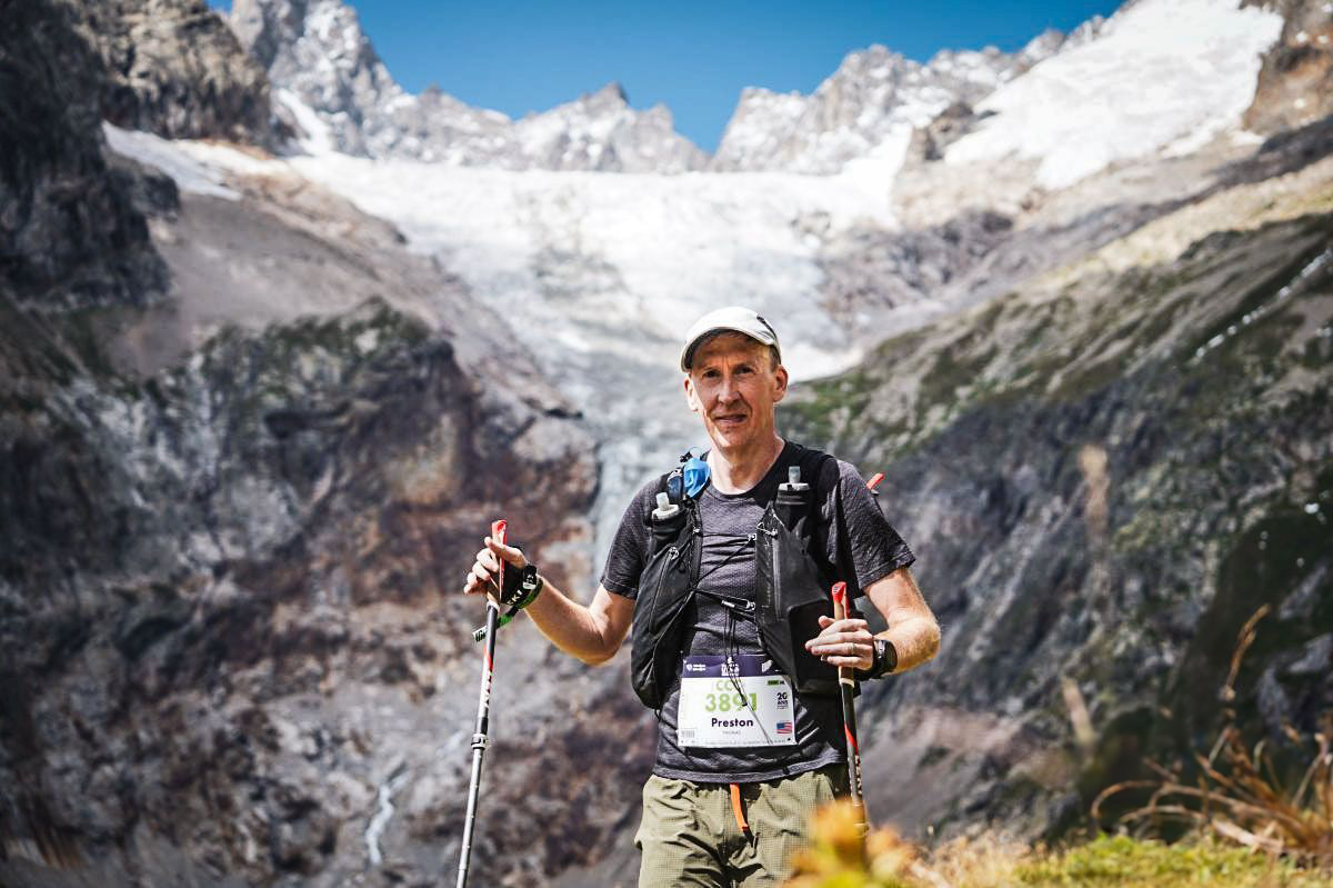 photo of Preston Thomas running CCC 100K at UTMB from Italy into Switzerland, and finishing in France.